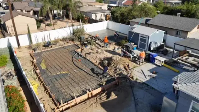 Crew pouring a concrete slab for a backyard ADU, a J.O. Construction job