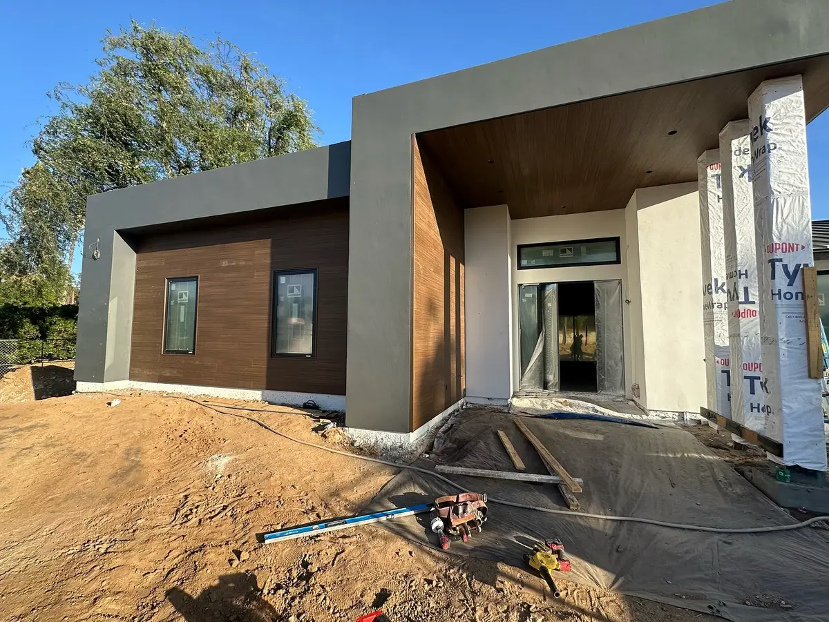 Wood siding going up at a modern custom home entry