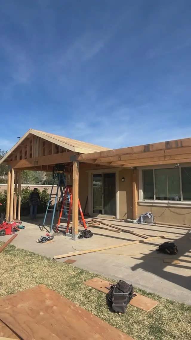 Patio addition framed off the back of a house