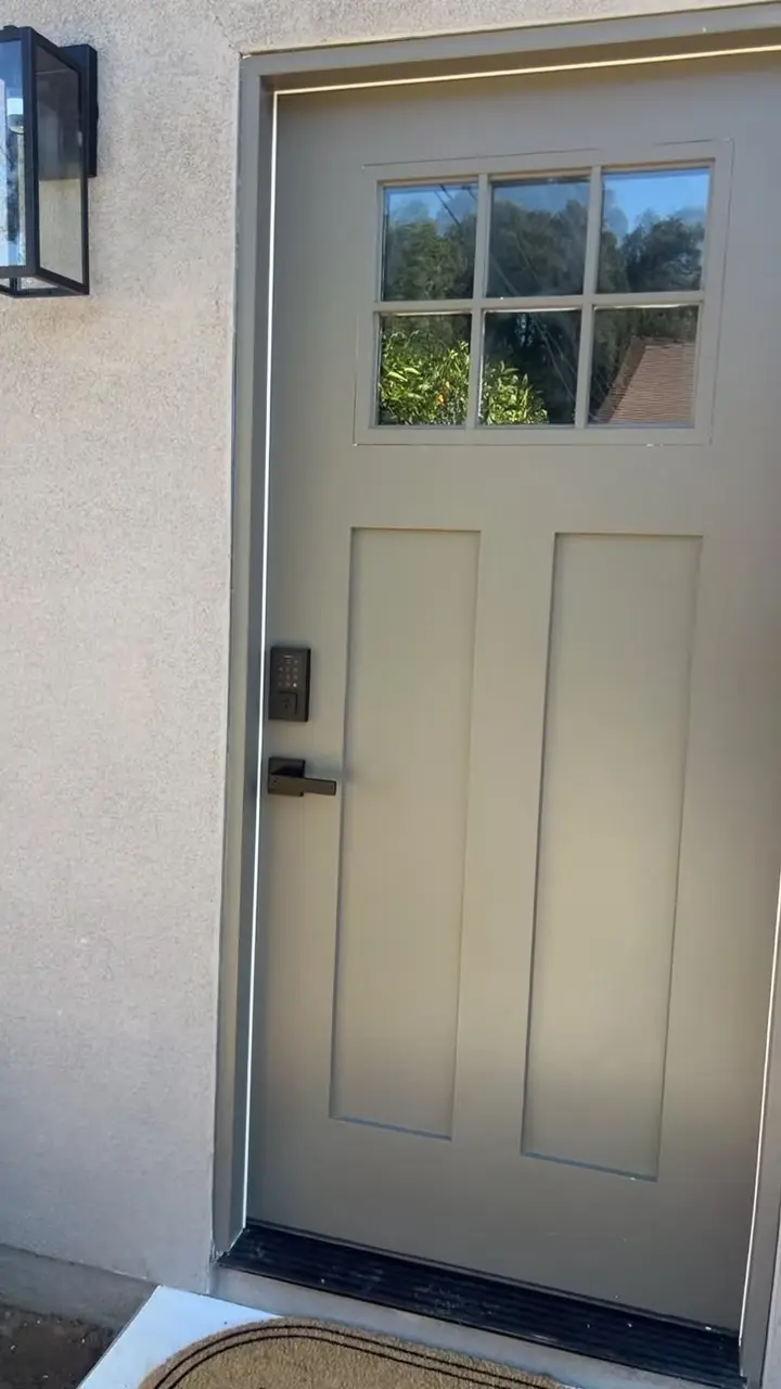 800 sq ft detached ADU in Riverside, CA: front door of a new adu with a glass top panel