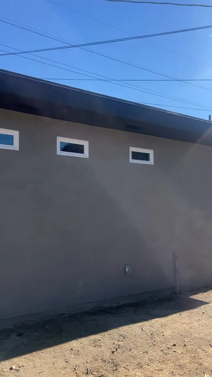 Stucco exterior of a detached ADU with clerestory windows