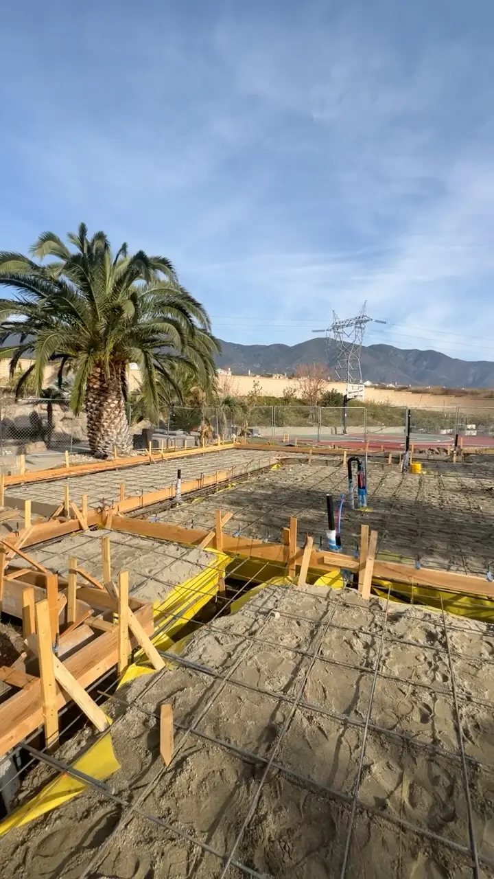Custom ADU with a pocket corner door in Rancho Cucamonga, CA: foundation forms and plumbing stubs ready for concrete